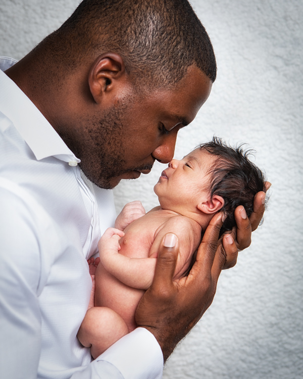 newborn baby photoshoot man father local